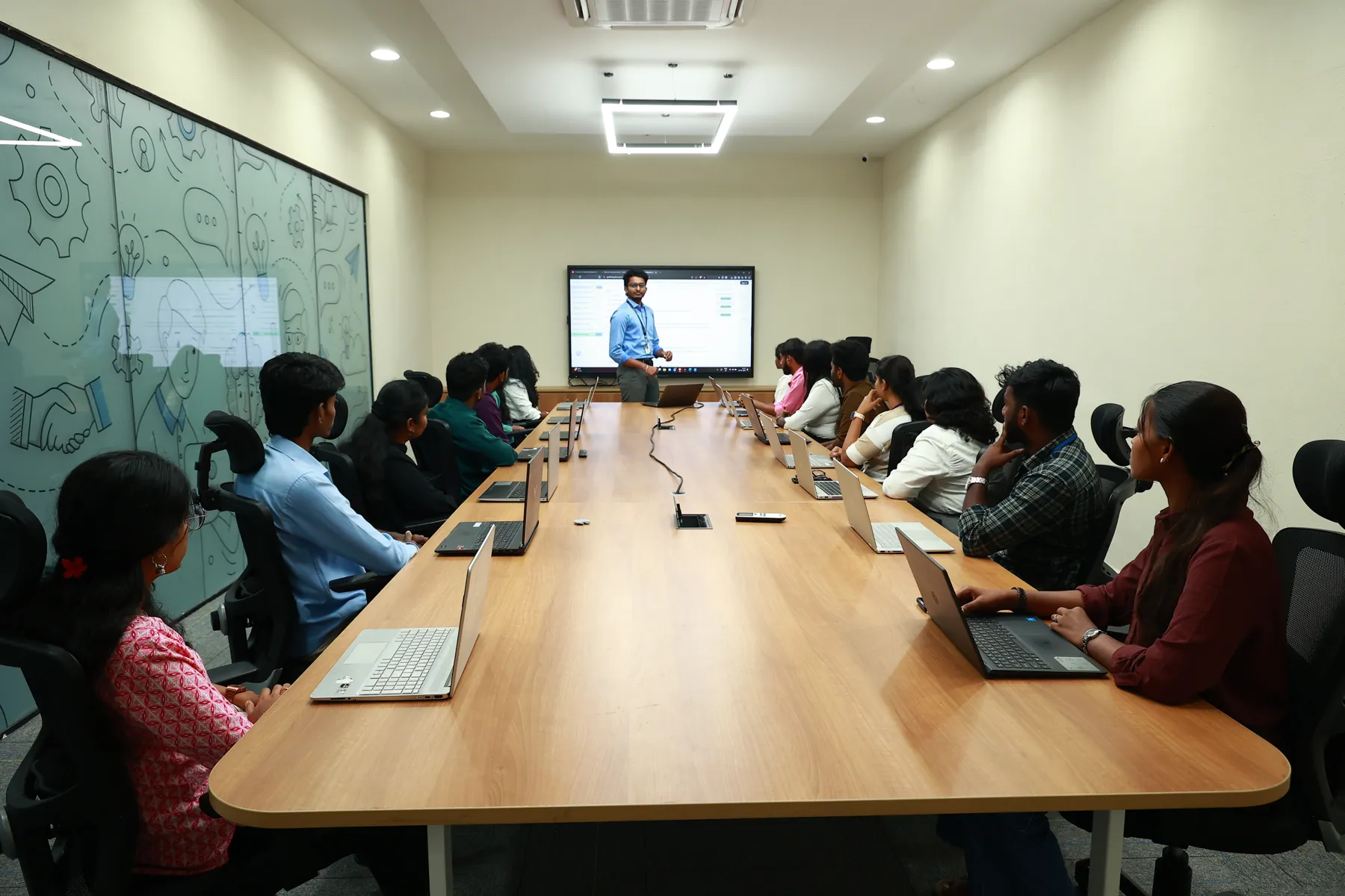 Students attending a live AI class with their trainer at the CPLC centre in Chennai