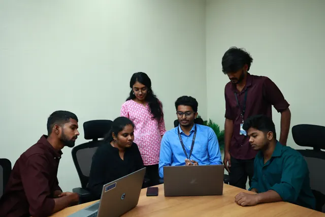 Students working on a project with their mentor